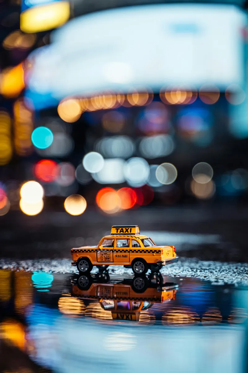 Car stopped roadside at night in wet conditions